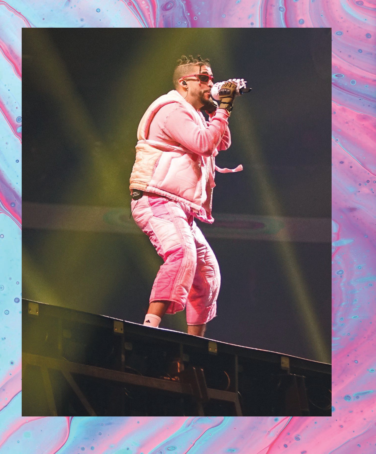 Catch Bad Bunny as the culture mogul performs his latest tunes in Atlanta this August. BAD BUNNY PHOTO BY WILLIAM PEREZ/BFA; BACKGROUND PHOTO BY PAWEL CZERWINSKI/UNSPLASH