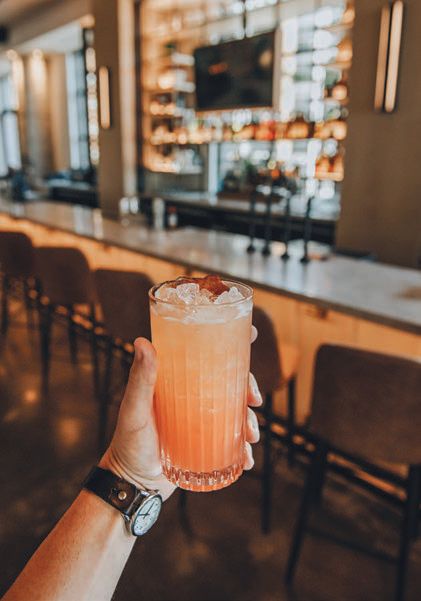 The Aquemini, made with peach-infused Banhez mezcal, chipotle agave, Aperol lemon and grapefruit zest. PHOTO BY CALEB JONES PHOTOGRAPHY