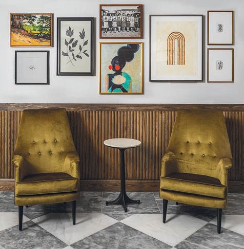 The lobby seating area features eclectic art. PHOTO COURTESY OF WYLIE HOTEL