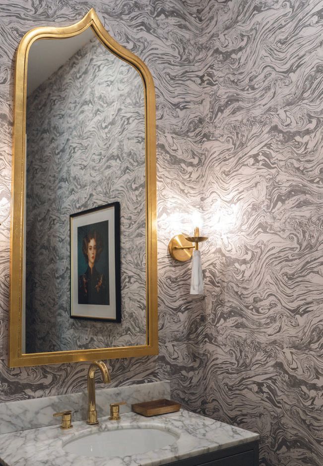 The guest bathroom on the main floor is a great example of the gorgeous tiling and artful wallpaper seen throughout The Rushmore PHOTOGRAPHED BY KAITIE BRYANT
