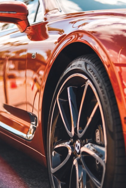 Roll up in a bright-red Bentley and all eyes are sure to be on you PHOTO: BY BAILEY MAHON/UNSPLASH