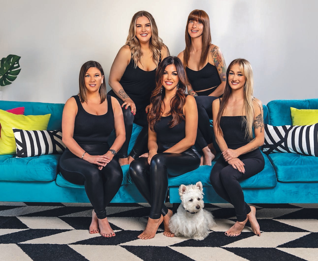 Spray Studio founder and owner Alicia Wente with her incredible team, including her pup, Yeti PHOTOGRAPHED BY RACHAEL ANN GLIEBE/RAG ARTISTRY