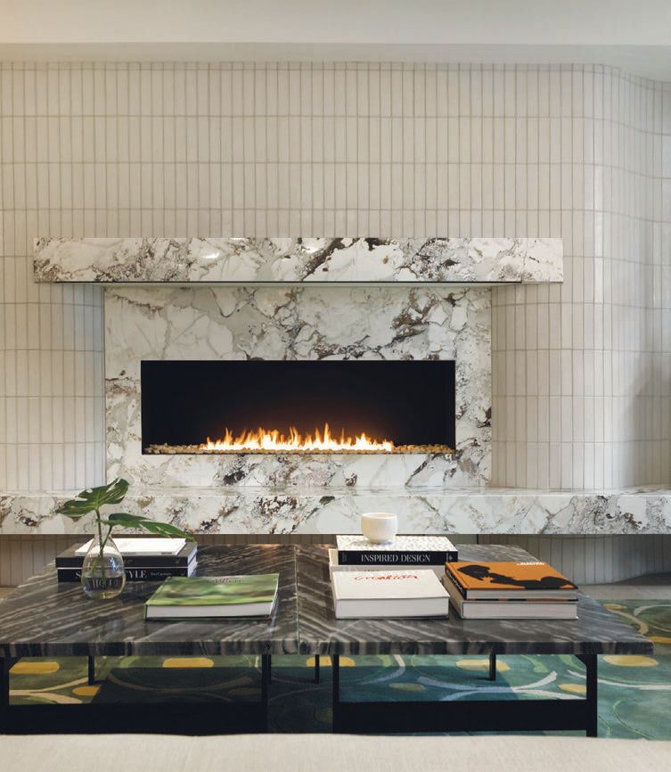The focal point of the lobby living room is the glazed tile-and-stone curved fireplace PHOTO BY CHRIS MOLINA